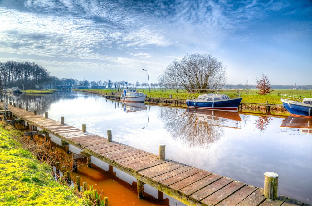 Free boat moored to dock in canal image, public domain CC0 photo.