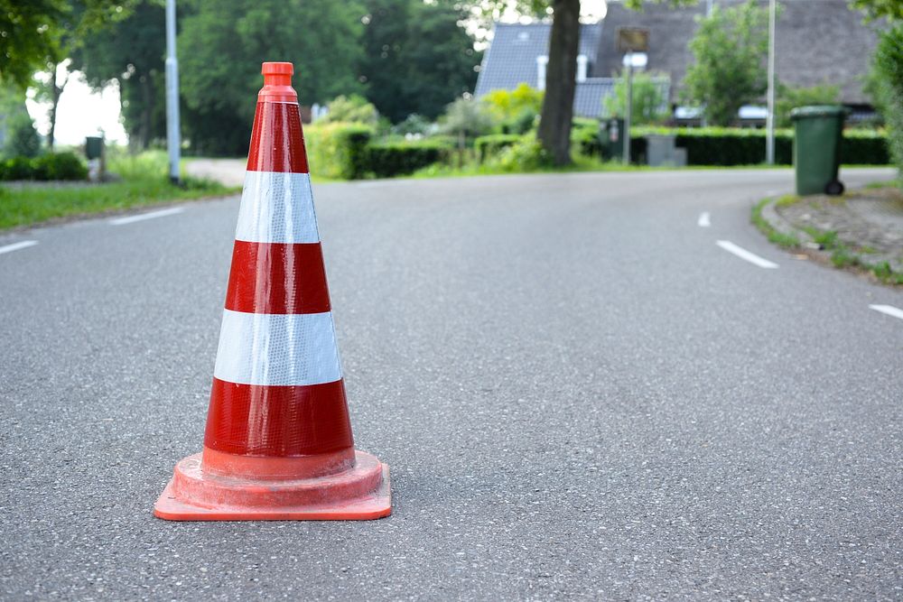 Free traffic cone on the road image, public domain CC0 photo.