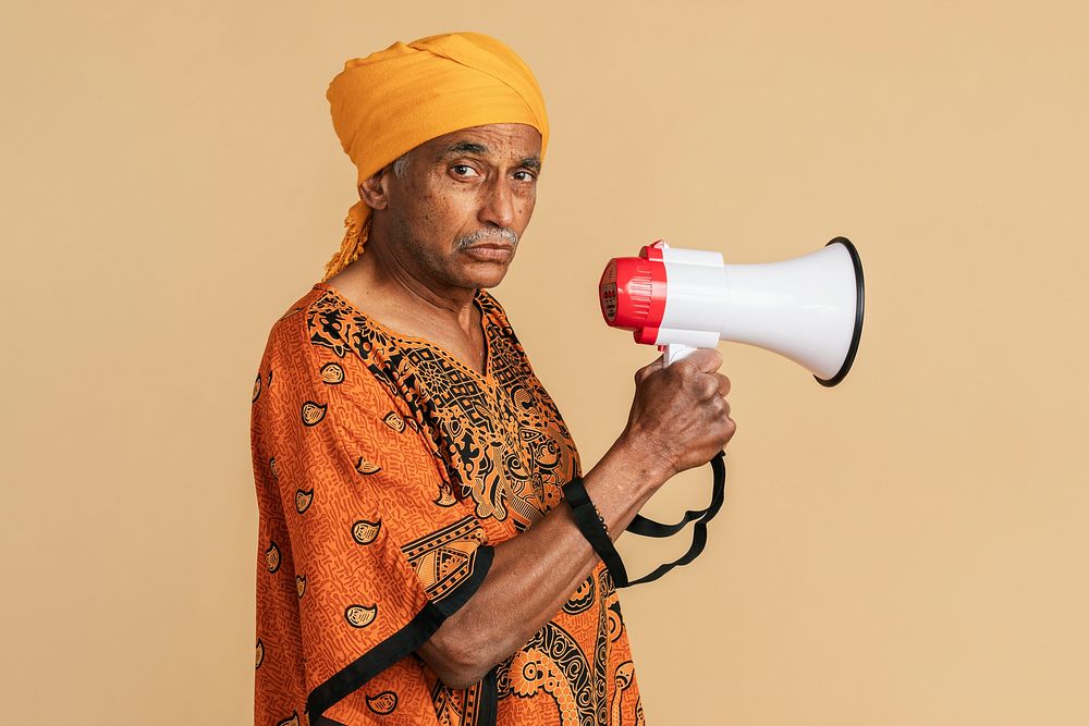 Mixed senior Indian man using a megaphone 