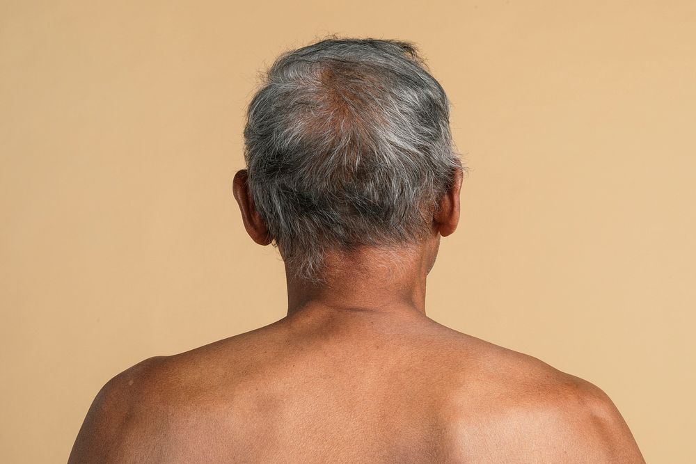 Back view of a mixed Indian senior man