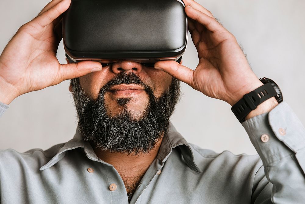 Businessman experiencing virtual reality with VR headset