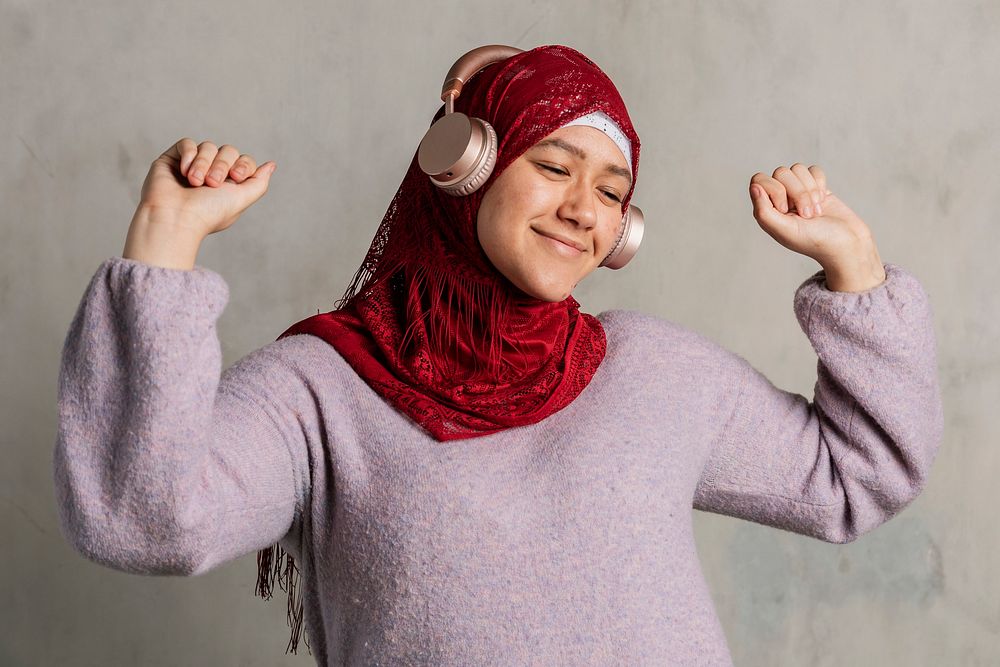 Muslim woman listening to music