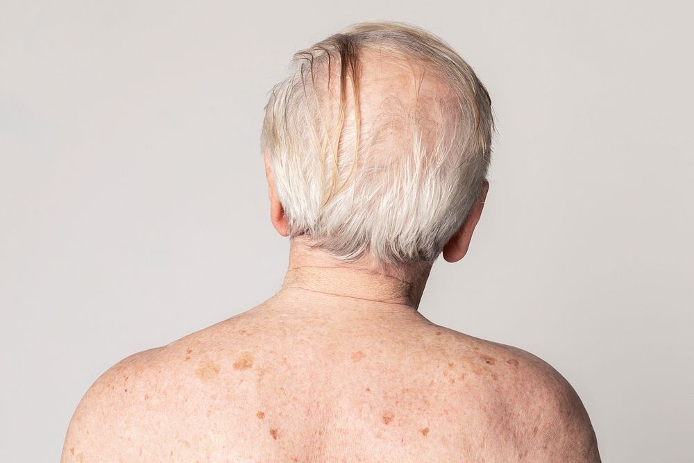 Back view of a senior man with white hair