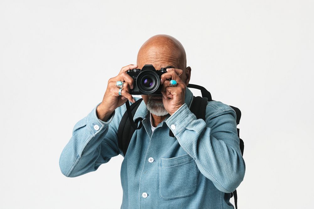 Senior man with a digital camera