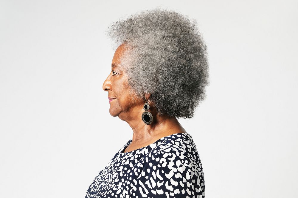 Black senior woman with afro hair in a profile shot