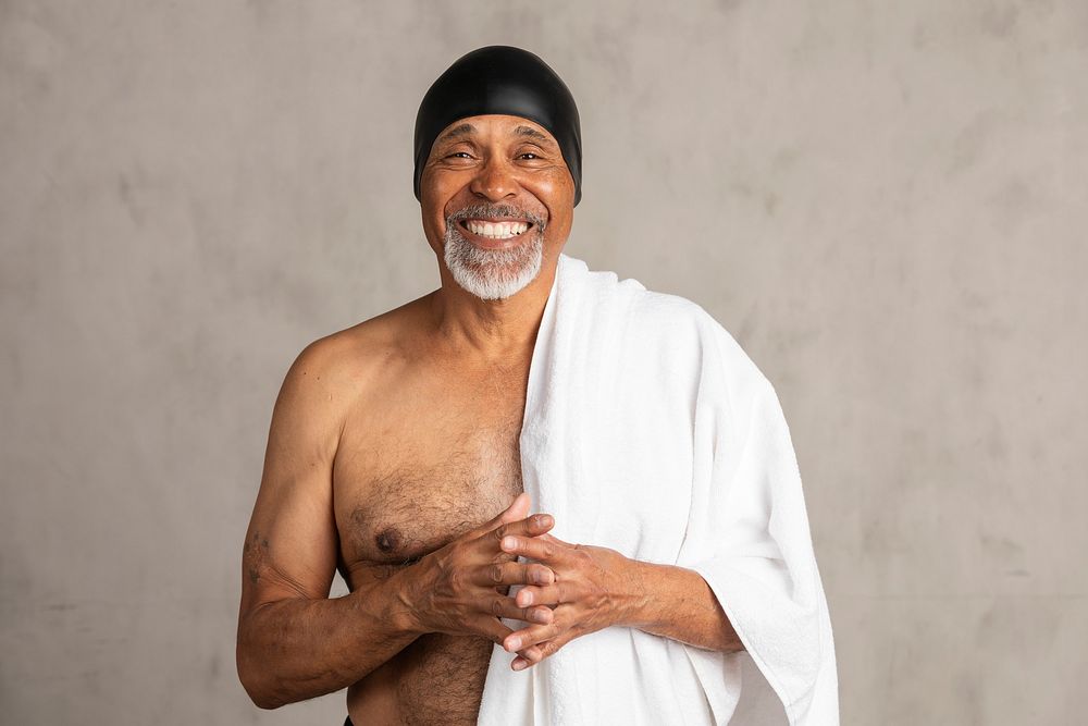 Senior African American man with a white bath towel