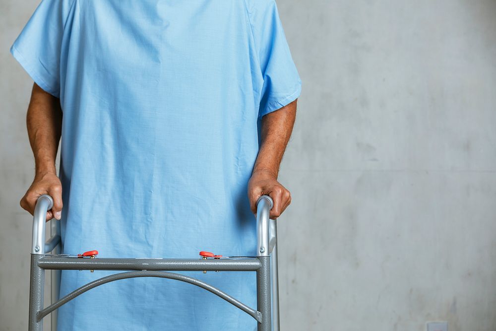 Patient using a zimmer frame 