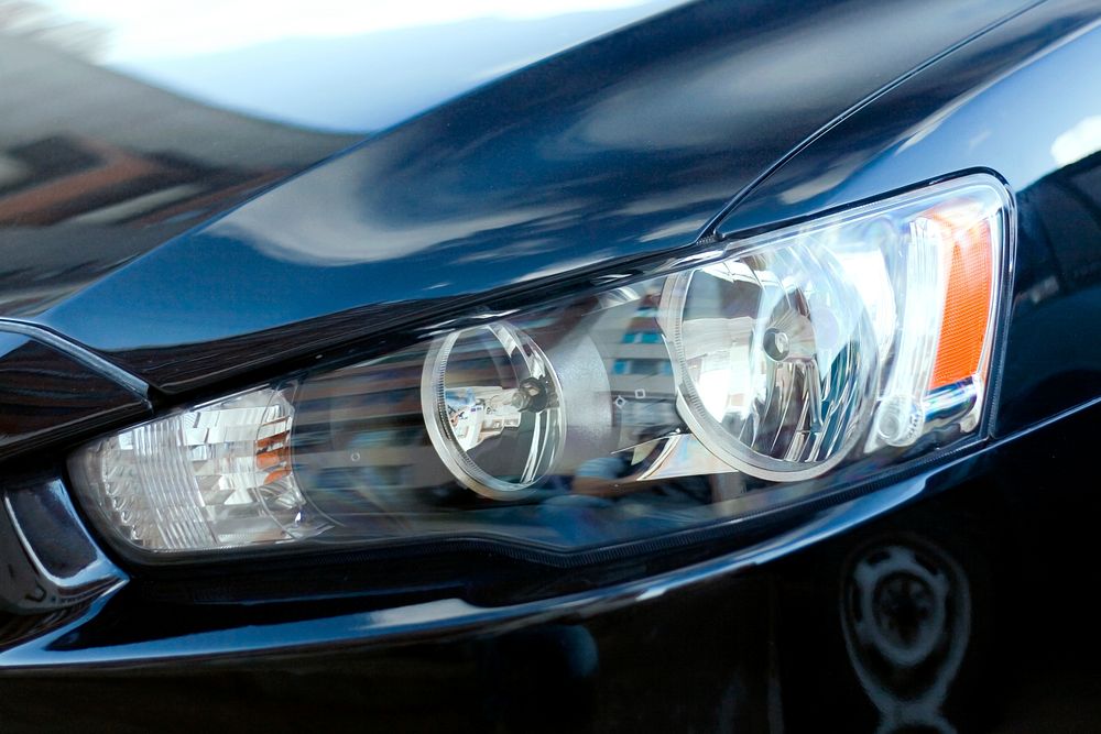 Car headlight close up photo, free public domain CC0 image.