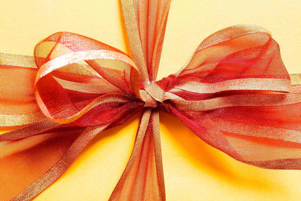 Orange ribbon gift box photo, free public domain CC0 image.