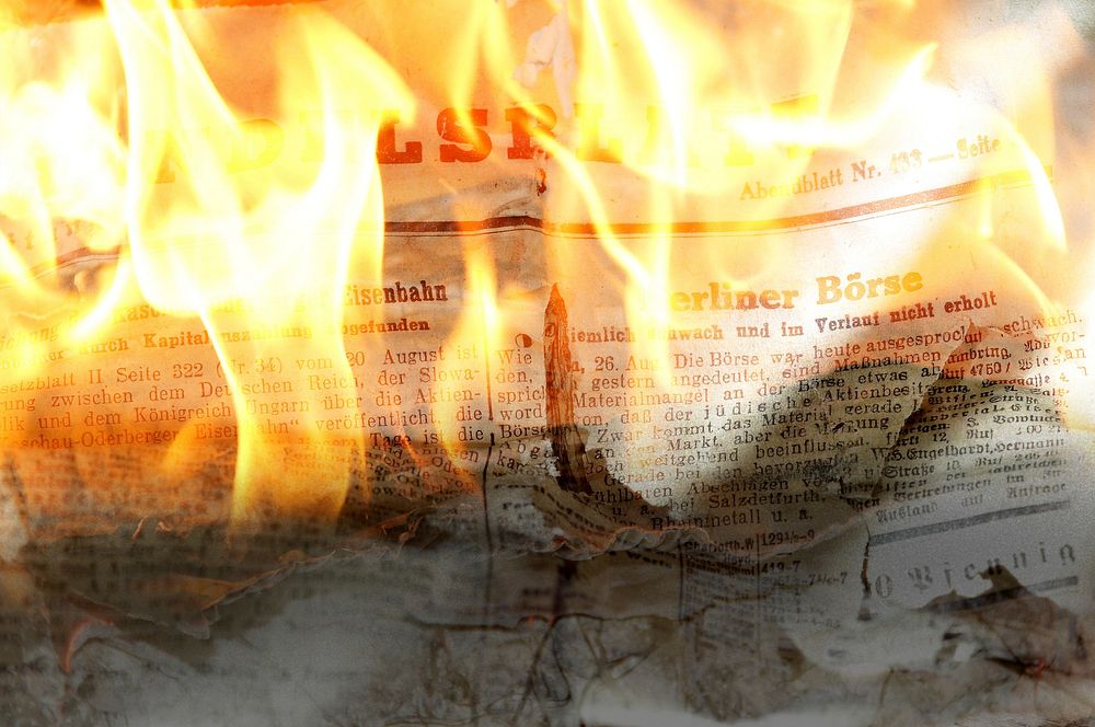 Free newpaper on fire photo, public domain CC0 image.