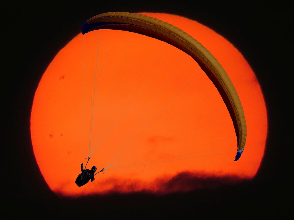 Free paragliding under full moon photo, public domain CC0 image.