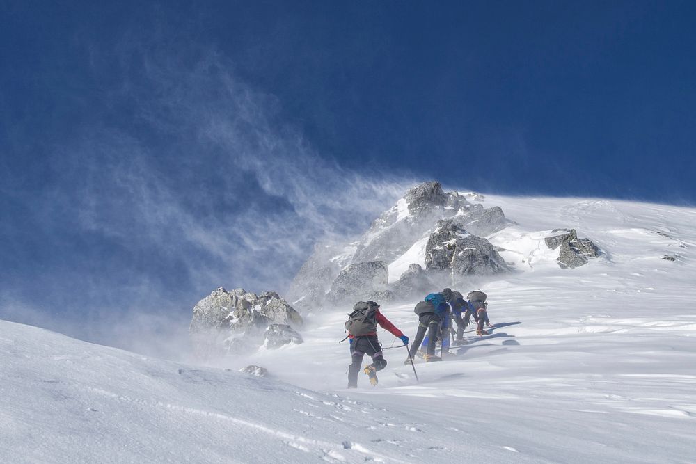 Free people hiking in snow mountain photo, public domain sport CC0 image.