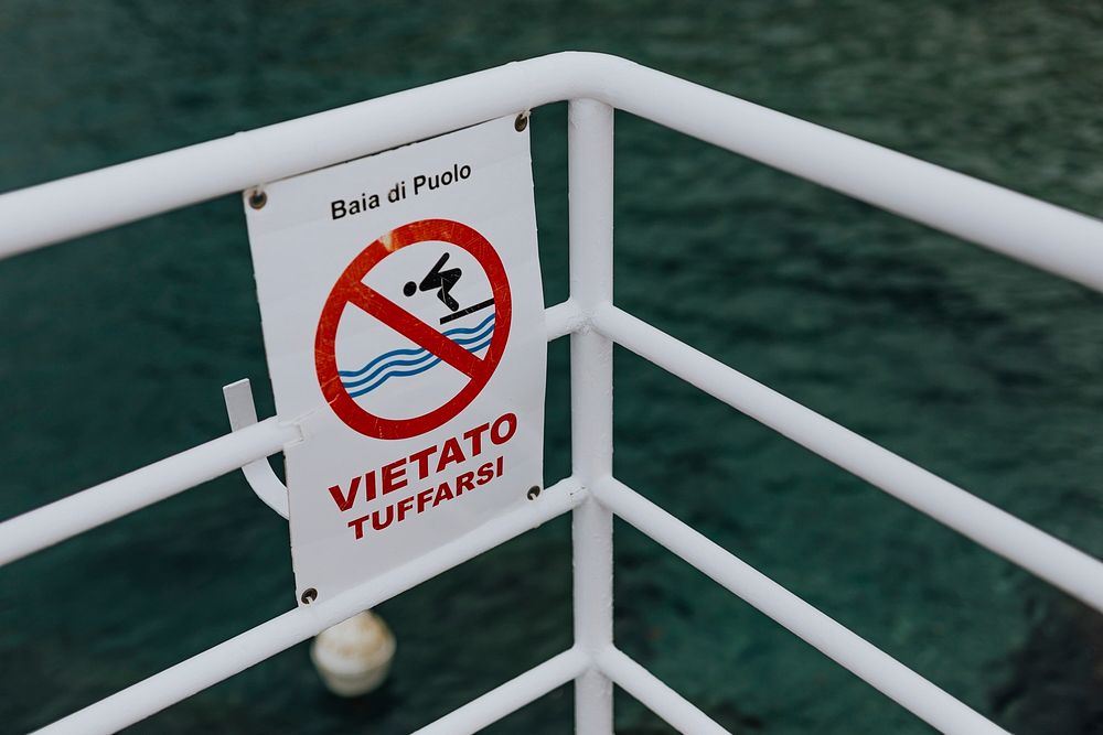 No diving sign on a boat at Puolo Bay, Italy