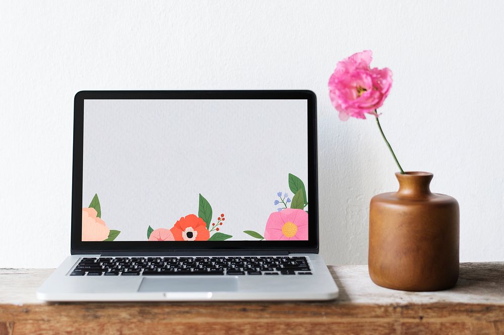 Blank laptop screen mockup by a pink peony