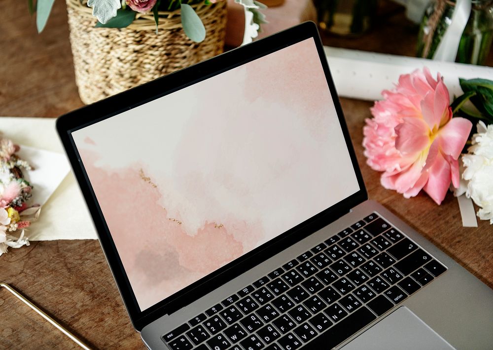 Blank laptop screen mockup on a table