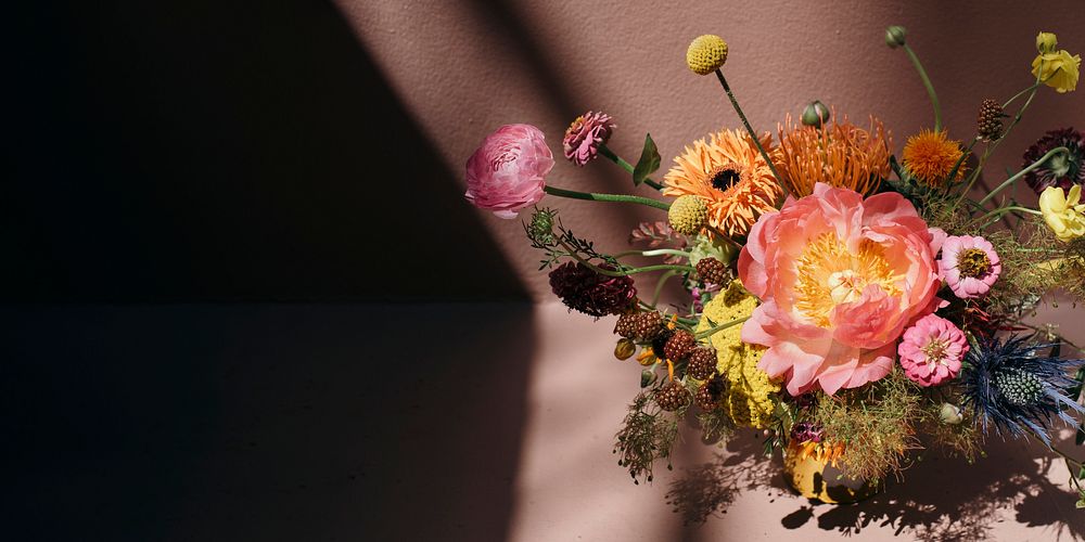 Colorful fresh flowers with pink background