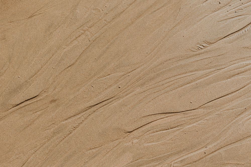 Beige sandy beach textured background