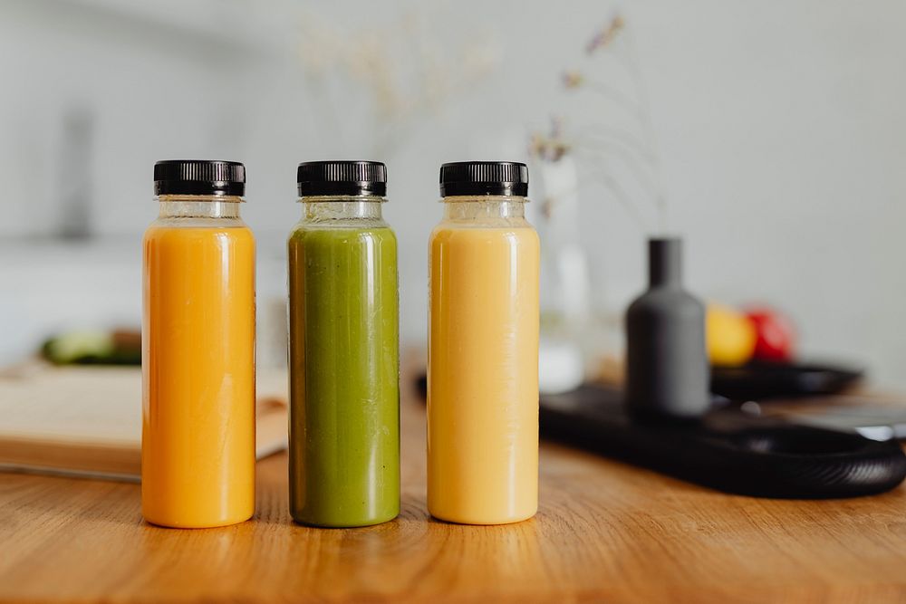 Homemade freshly squeezed juice in bottles on a table