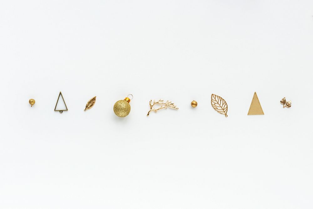Golden Christmas ornaments on a white background