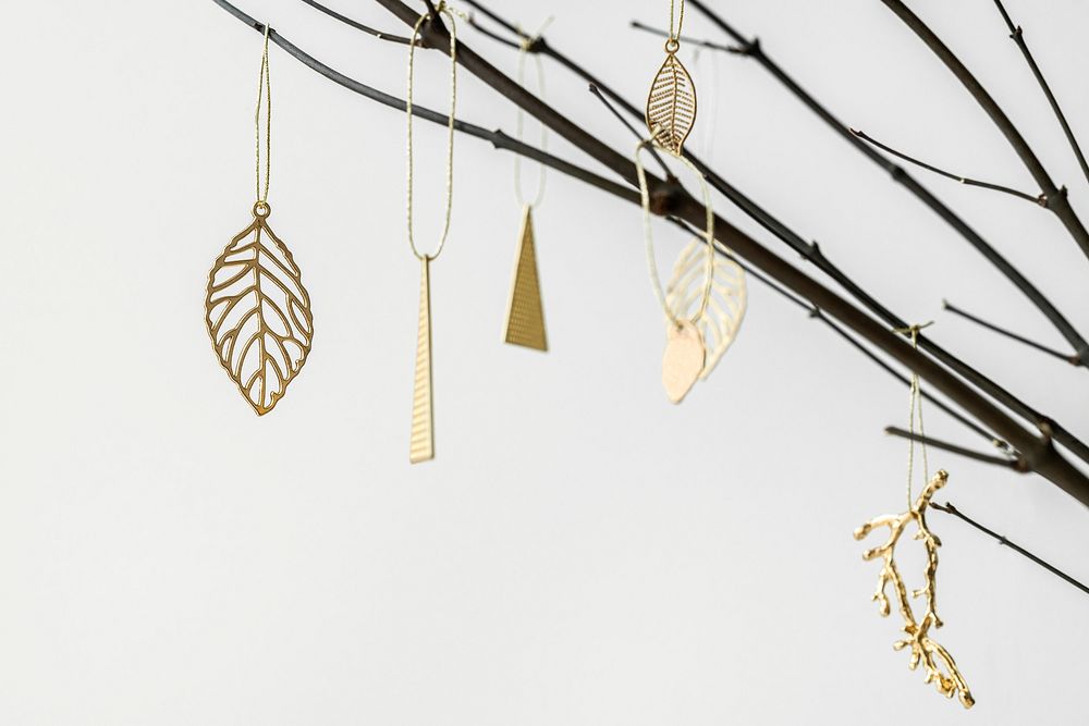 Festive golden Christmas ornaments on a branch