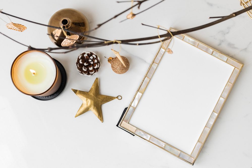 Festive frame on a table with Christmas ornaments