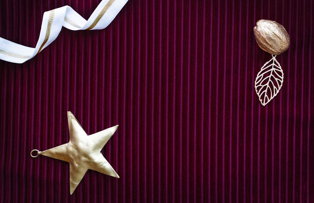 Festive golden star on a burgundy background
