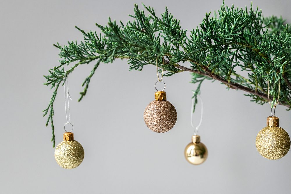 Golden festive baubles on a Christmas tree