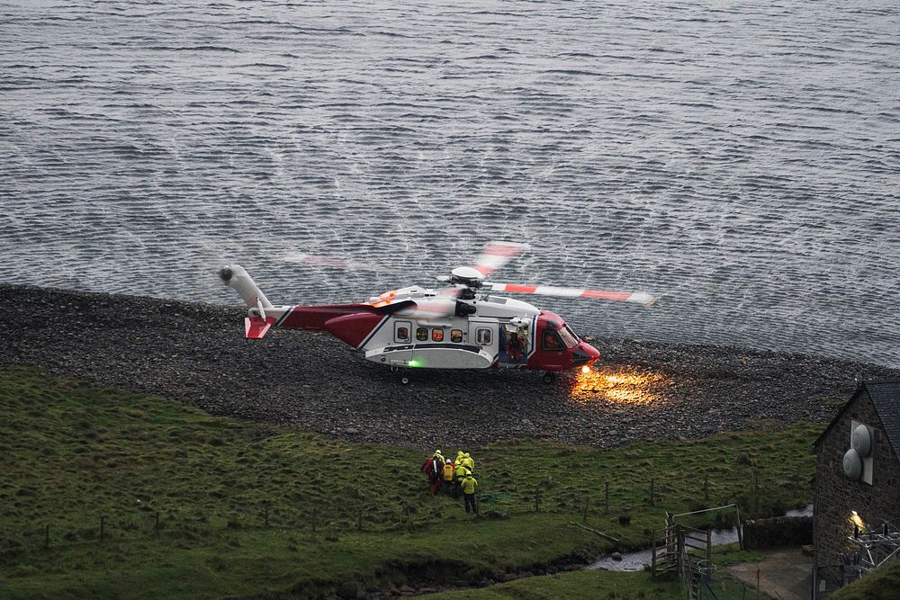 Coastguard helicopter landing on the island in Scotland