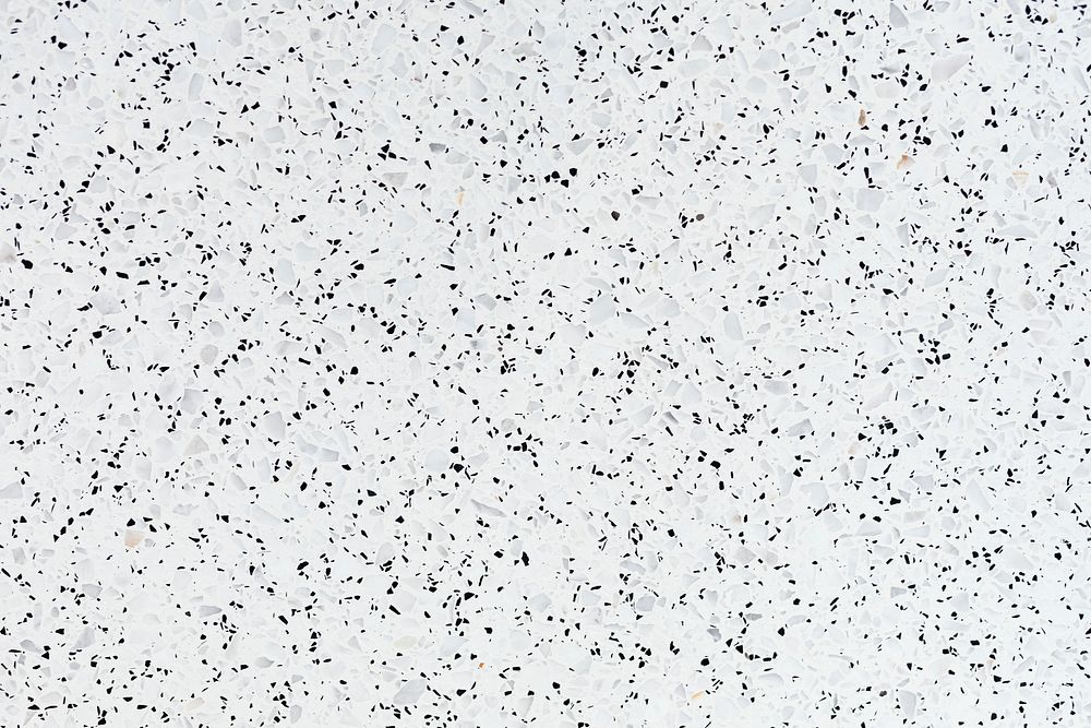 White granite textured tile with black stains