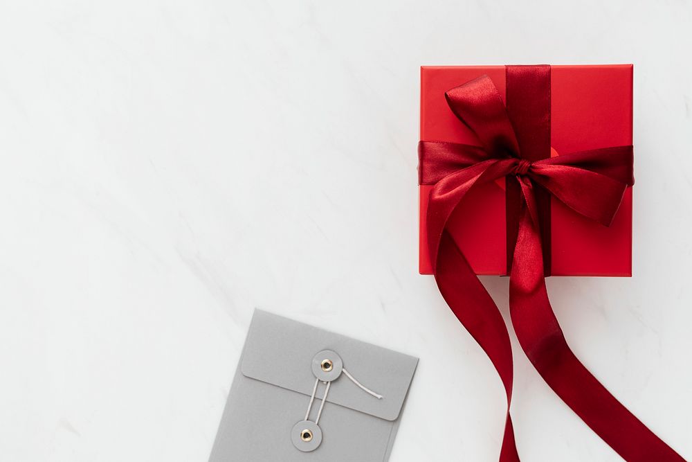 Red present by a gray envelope