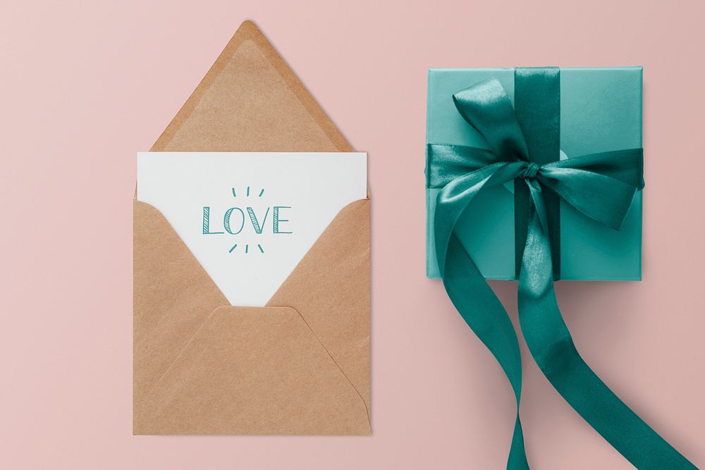 Green present by a brown envelope mockup