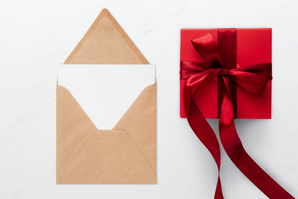Red present by a brown envelope