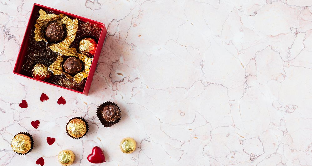 Chocolates in a marble texture background