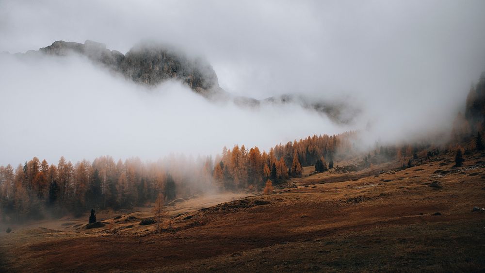 Nature desktop wallpaper background, misty Dolomites valley