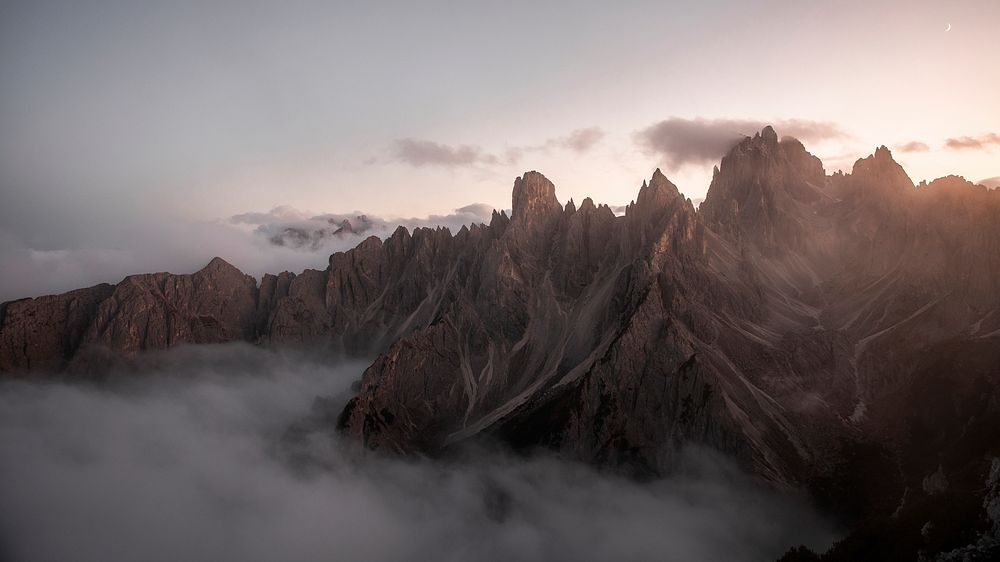 Mountain desktop wallpaper background, foggy Tre Cime di Lavaredo in Dolomites, Italy