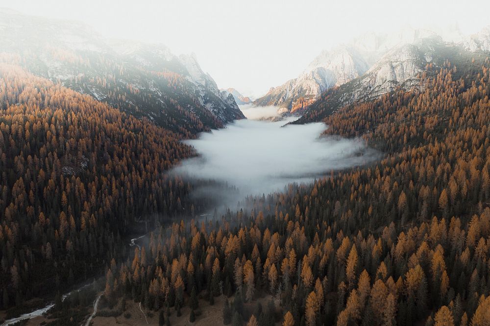 The Dolomites shrouded by the mist during autumn