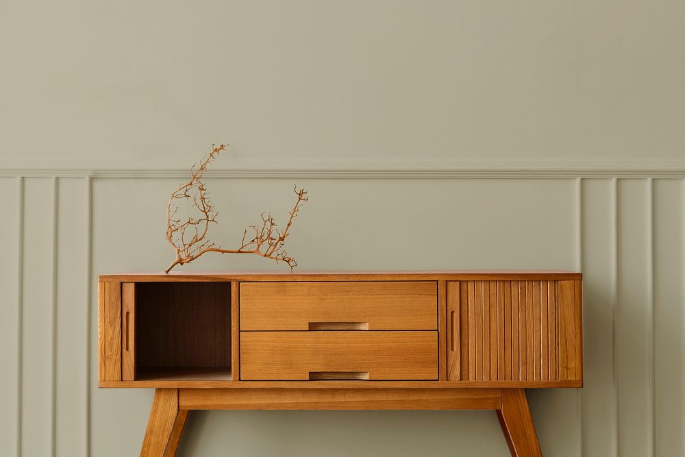 Wooden sideboard table mockup against a wall