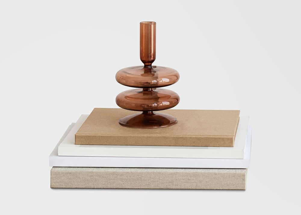 Modern brown vase on a stack of books