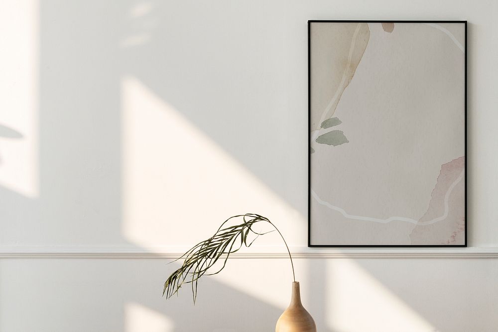 Picture frame mockup hanging on a white wall 