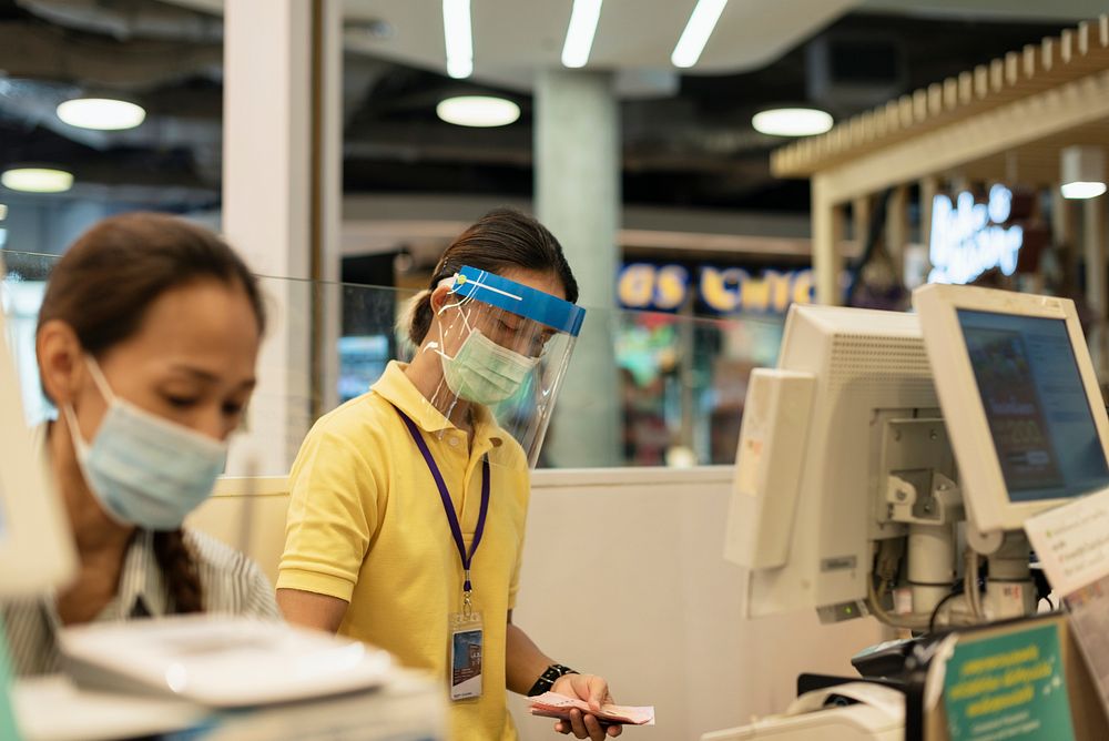 Cashiers in a supermarket during covid-19 pandemic. BANGKOK, THAILAND, 24 March, 2020