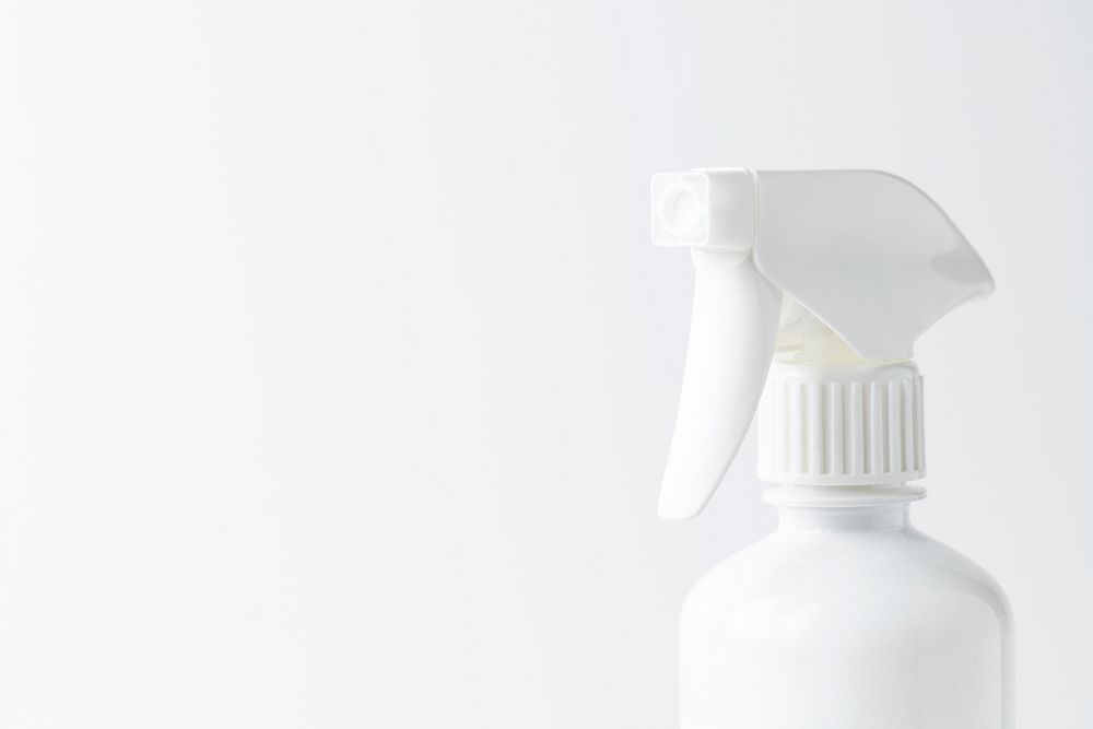 White spray bottle on a plain background