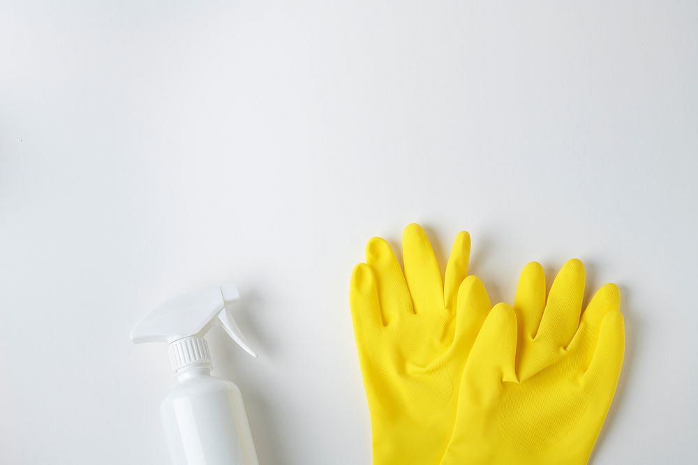 Yellow gloves and a white spray bottle