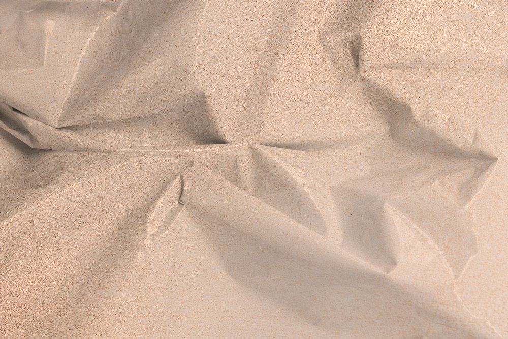 Crumpled grainy textured beige plastic textile background mockup