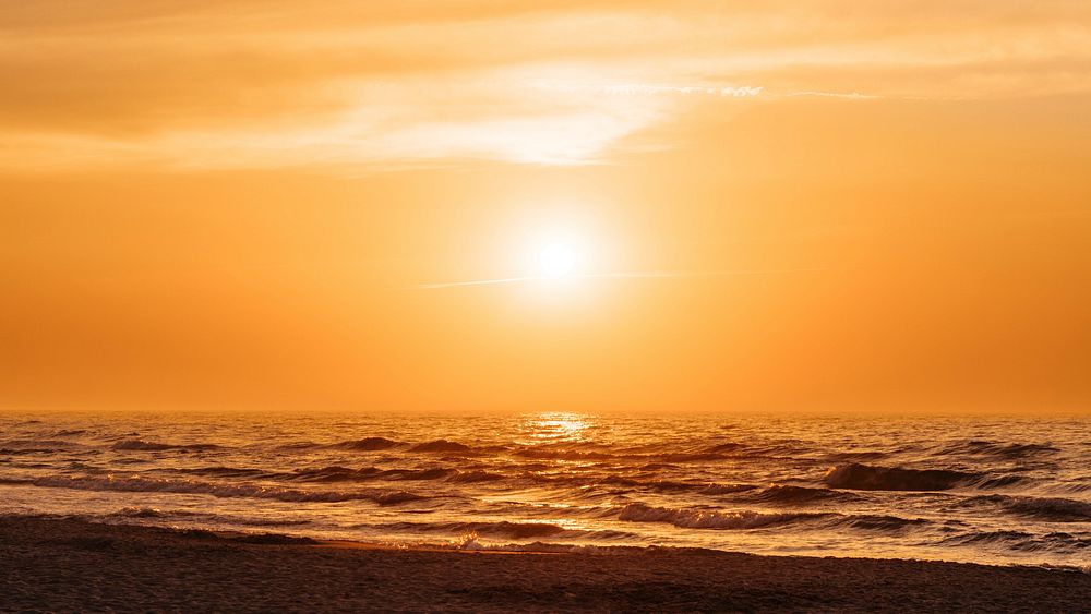 Orange sunset at a beach in the summer