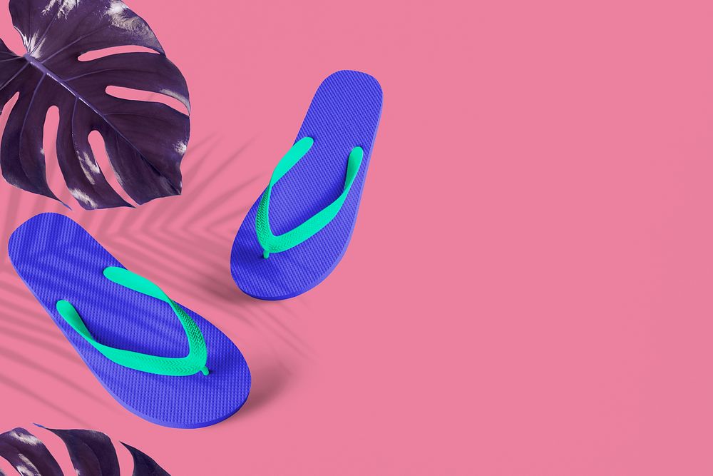 Blue flip-flops with indigo Monstera background
