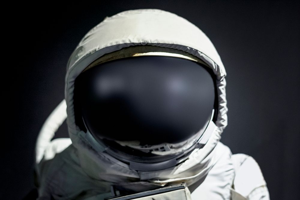 Astronaut fitted with spacesuit in outer space