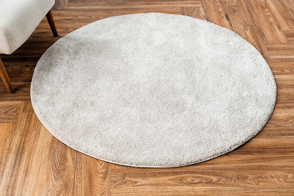 White round rug on wooden floor