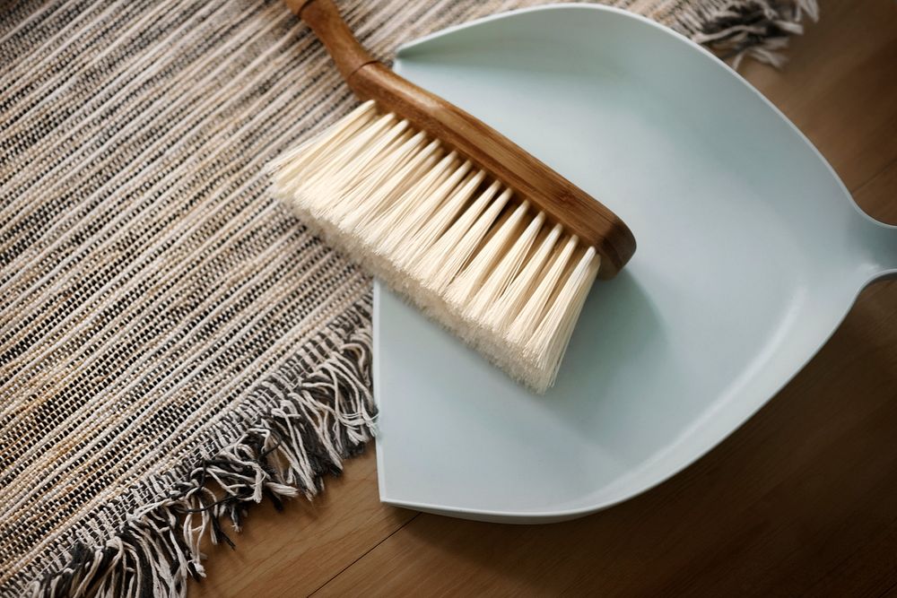 Dustpan and cleaning brush living essentials in lifestyle concept