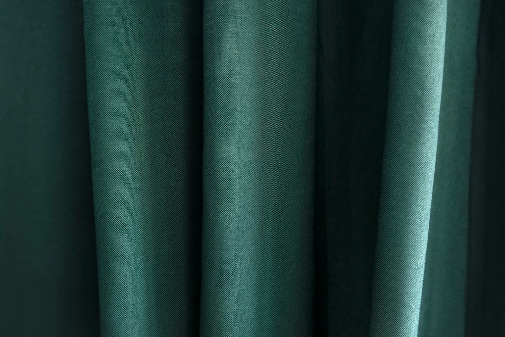 Closeup of green textile with pleats