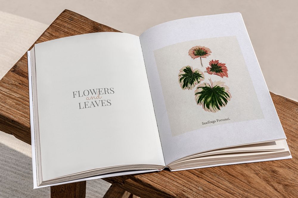 Opened floral magazine pages on a table